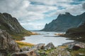 Hiking impressions at Bunes sand beach with view to Bunes Fjorden at Lofoten Islands in Norway on a blue sky with clouds