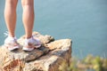 Hiking legs stand seaside rock Royalty Free Stock Photo