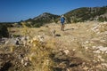 Hiking Lycian way. Man and dog trekking on Lycian Way trail on stretch between Kalkan and Kas, Trekking