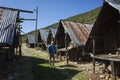 Hiking Lycian way. Man is trekking next to Traditional wooden depots in Bezirgan highlands on Lycian Way trail