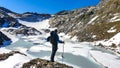 Hiking man with backpack with scenic view on the High Tauern mountains in Carinthia, Salzburg, Austria, Europe, Alps. Glacier