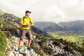 Hiking man checking direction in mountains