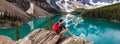 Hiking Man Looking at Moraine Lake & Rocky Mountains Panorama