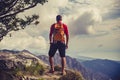 Hiking man or trail runner in inspiring mountains Royalty Free Stock Photo
