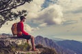 Hiking man or trail runner looking at mountains