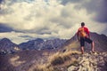 Hiking man or trail runner in mountains Royalty Free Stock Photo