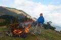 Hiking man try to light fire Royalty Free Stock Photo