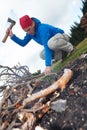 Hiking man try to light fire Royalty Free Stock Photo