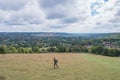 Hiking man walking in the field, Amazing view of Goring and Streatley, village town near Reading, England