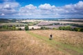 Hiking man walking in the field, Amazing view of Goring and Streatley, village town near Reading, England