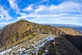 Hiking through mountain landscape in early spring, mount Stolovi