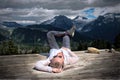 Carefree woman lying down on tent pad after hiking day.