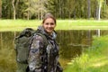 Girl traveler in forest looks at forest. outdoor adventures outdoor. Forest holidays Royalty Free Stock Photo