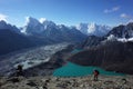 Hiking in Nepal Himalayas, Male tourist walking up to Gokyo Ri with view of Gokyo lake, Gokyo village, Ngozumba glacier Royalty Free Stock Photo