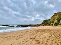 Hiking over the cliffs of Praia Dos Aveiros in Albufeira, Portugal