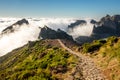 Hiking over Madeira island. The trail around the top mountains on the island - Pico do Arieiro. Royalty Free Stock Photo