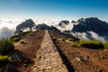 Hiking over Madeira island. The trail around the top mountains on the island - Pico do Arieiro. Royalty Free Stock Photo