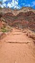 Hiking path along the massiv cliffs seen from Bright Angel hiking trail at South Rim of Grand Canyon National Park, Arizona Royalty Free Stock Photo