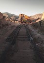 Hiking Path along Rail Road Railroad Tracks Leading to Abandoned Rail Cars at Sunset