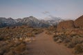 A hiking path heads toward the Sierra Nevada mountains in the Alabama Hills area Royalty Free Stock Photo