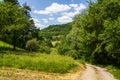 Hiking path, hill panorama, meadows, forest with trees near Wichsenstein in Franconian Switzerland, Germany Royalty Free Stock Photo