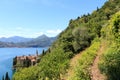 Hiking path and panorama of lakeside village Varenna at Lake Como with mountains in Lombardy