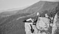 Hiking peaceful moment. Enjoy the view. Tourist hiker girl relaxing edge cliff. Dangerous relax. Extreme concept. On Royalty Free Stock Photo