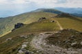 Hiking rocky mountain path going by mountain range with spectacular views. Low Tatras Nizke Tatry Crest Trail landscape view. Royalty Free Stock Photo