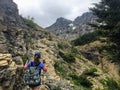 Hiking the rocky terrain of the Crypt Lake Trail, a steep ascent