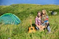 Hiking romance. Summer vacation. Boyfriend girlfriend guitar near camping tent. Couple in love happy relaxing nature Royalty Free Stock Photo