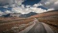 Hiking in Rondane national park with winding path Royalty Free Stock Photo