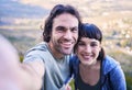 Hiking, selfie and portrait of couple in nature for adventure, holiday and journey on mountain. Travel, dating and happy