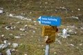 Hiking signs posting to a family via ferrata close to St. Antoenien, Switzerland Royalty Free Stock Photo