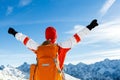 Hiking success, woman in winter mountains