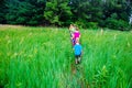 Hiking in Tall Green Grasses Royalty Free Stock Photo