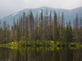 Hiking in Tatra National Park, Poland, in May. Beautiful panoramic view on rocky mountains and Czarny Staw Black Pond Royalty Free Stock Photo