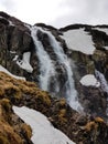 Hiking in Tatra National Park, Poland, in May. Beautiful panoramic view on rocky mountains and a waterfall Royalty Free Stock Photo