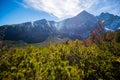 Hiking to mountain lake in National Park High Tatra in autumn and sunny day. Dramatic overcast sky. Zelene pleso, Slovakia, Europe Royalty Free Stock Photo