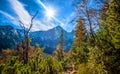 Hiking to mountain lake in National Park High Tatra in autumn and sunny day. Dramatic overcast sky. Zelene pleso, Slovakia, Europe Royalty Free Stock Photo