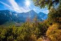 hiking to mountain lake in National Park High Tatra in autumn and sunny day. Dramatic overcast sky. Zelene pleso, Slovakia Royalty Free Stock Photo
