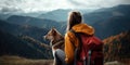 hiking tourist girl and dog in mountains Royalty Free Stock Photo