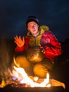 Hiking tourist have a rest in his camp at night Royalty Free Stock Photo