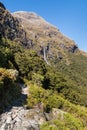 Hiking track leading to Earland Falls waterfall on Routeburn Track in Fiordland National Park, New Zealand
