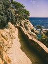 A hiking trail along the cliffs for tourists on Costa Brava of the Mediterranean Sea in Spain near Lloret de Mar Royalty Free Stock Photo