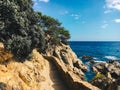 A hiking trail along the cliffs for tourists on Costa Brava of the Mediterranean Sea in Spain near Lloret de Mar Royalty Free Stock Photo