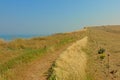 Hiking path along a field on the cliffs on the French Northe sea coast, Royalty Free Stock Photo