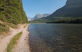 Hiking trail along shore of Fishercap Lake on the Swiftcurrent hiking trail in Glacier National Park in Montana USA