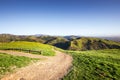 Hiking trail through the green hills and valleys of the Diablo Range mountains in south San Francisco Bay area on a sunny day, Royalty Free Stock Photo