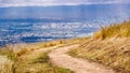 Hiking trail on the hills of South San Francisco bay area, aerial view of downtown San Jose visible in the background; California Royalty Free Stock Photo