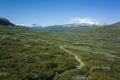 Hiking trail in Lapland. Arctic nature of Scandinavia in warm summer sunny day with blue sky Royalty Free Stock Photo